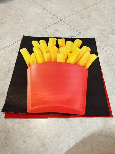 French fries costume board laid flat showing the red carton and three-dimensional fry sticks