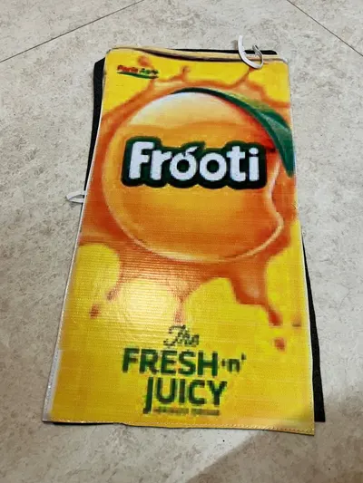 Frooti mango drink carton costume board laid flat showing the printed pack and shoulder ties
