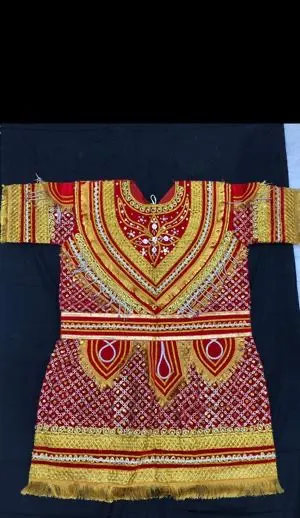 Raja Ram dress laid flat — red kurta with a gold zari V-yoke, white stone work, gold fringed sleeves and a gold-banded fringed hem