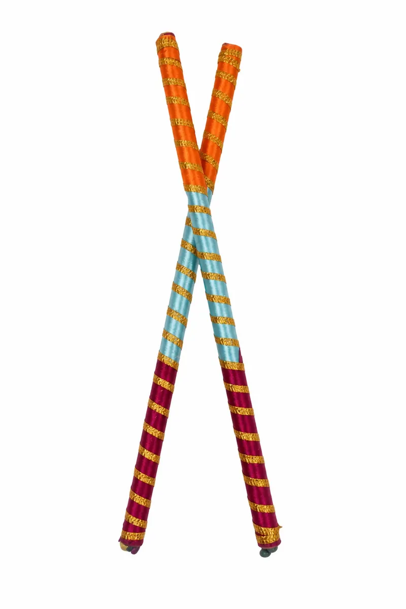 Pair of dandiya sticks wrapped in orange, sky blue and maroon ribbon with gold bands